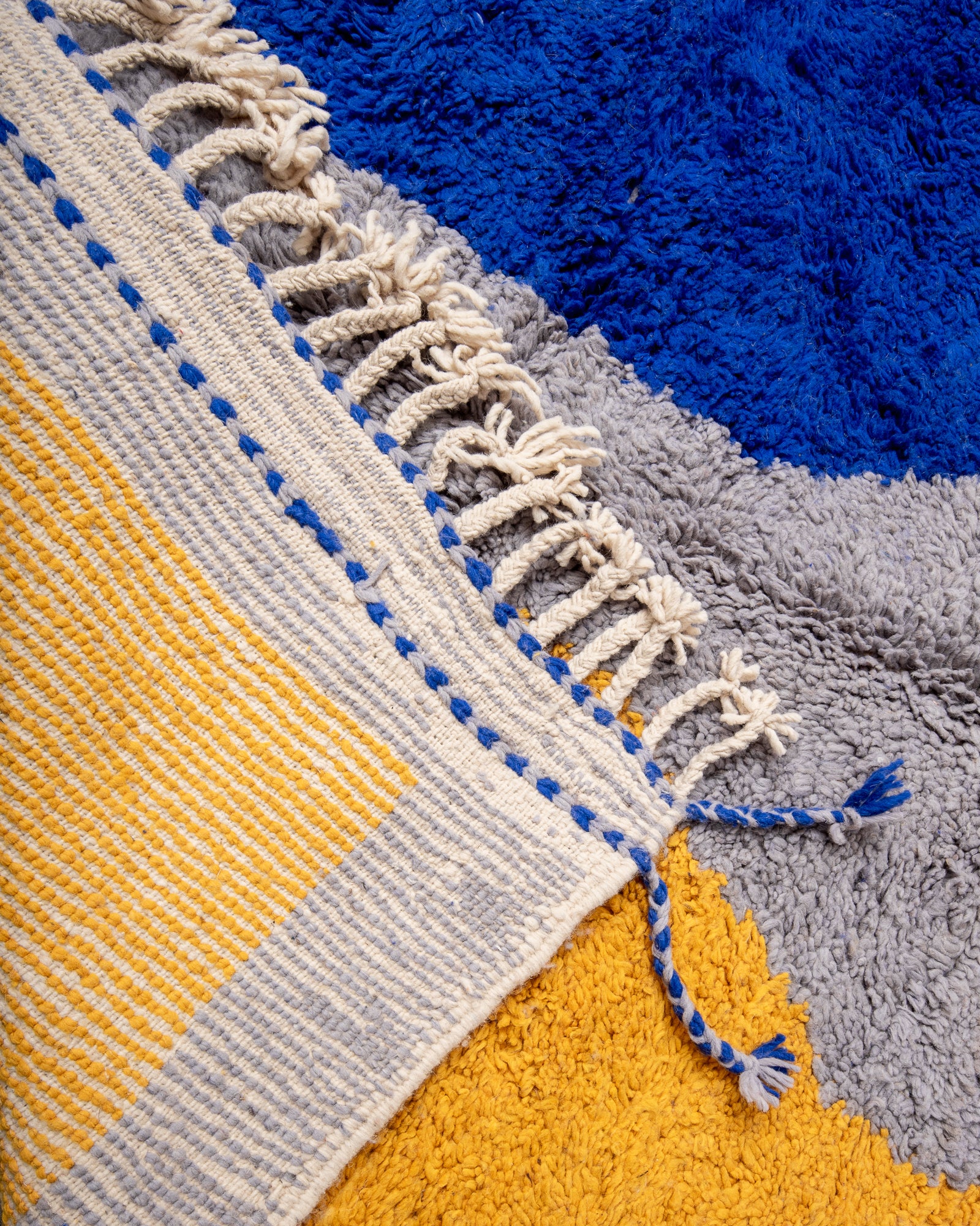 Modern, designer, handcrafted Berber rug from Morocco. Beniourain carpet with beautiful colours and patterns and fluffy wool texture.